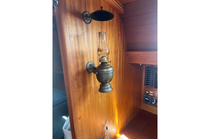 Slide: The Image of Vintage oil lamp on wooden interior of 1984 Vindo 34 sailboat. - 13