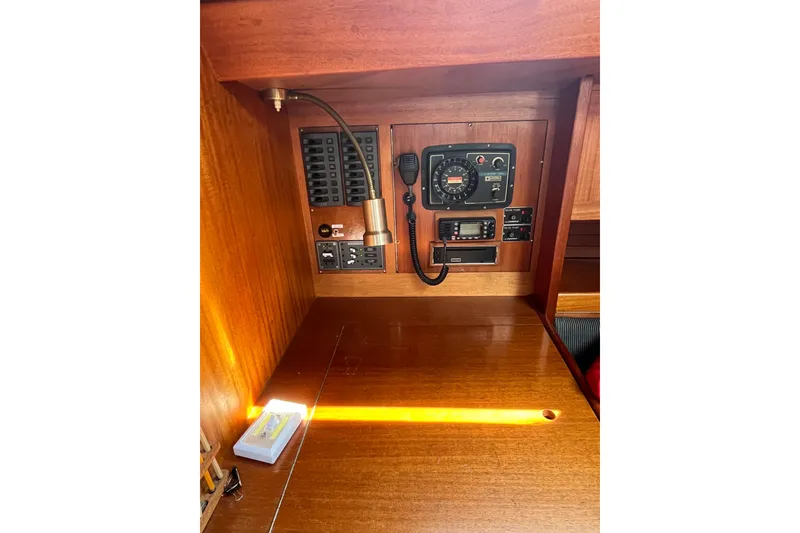 Slide: The Image of Control panel of a 1984 Vindo 34 sailboat with radio and gauges. - 7
