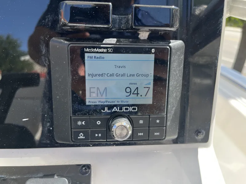 Slide: The Image of JL Audio media system on a Sea Hunt Ultra 234 boat. - 14