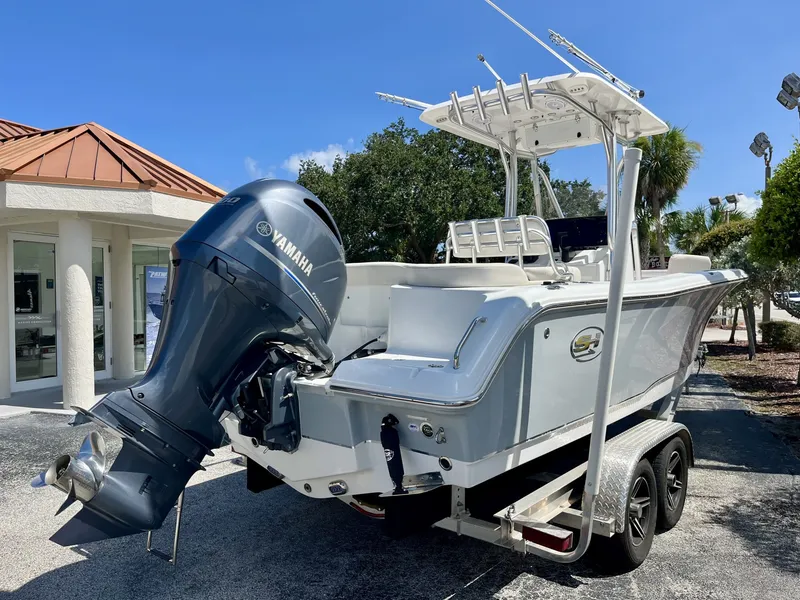 Slide: The Image of A 2022 Sea Hunt Ultra 234 boat on a trailer, featuring a Yamaha outboard motor. - 6