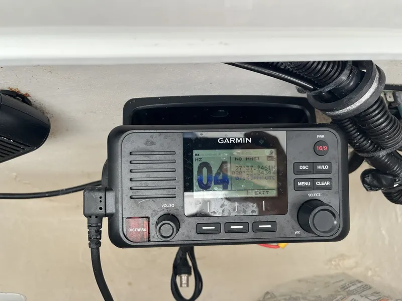 Slide: The Image of A Garmin radio is installed in a boat, surrounded by cables and a speaker. - 15