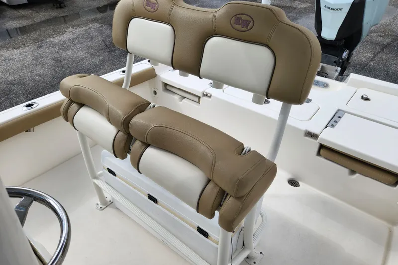 Slide: The Image of 2019 Key West 230 Bay Reef boat seating with tan and white upholstery. - 11