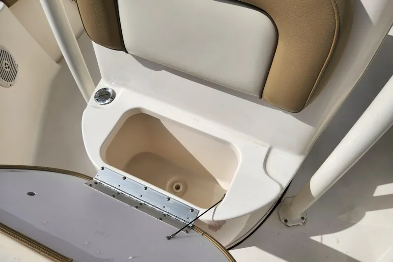 Slide: The Image of 2019 Key West 230 Bay Reef boat storage compartment with cushioned seating. - 9
