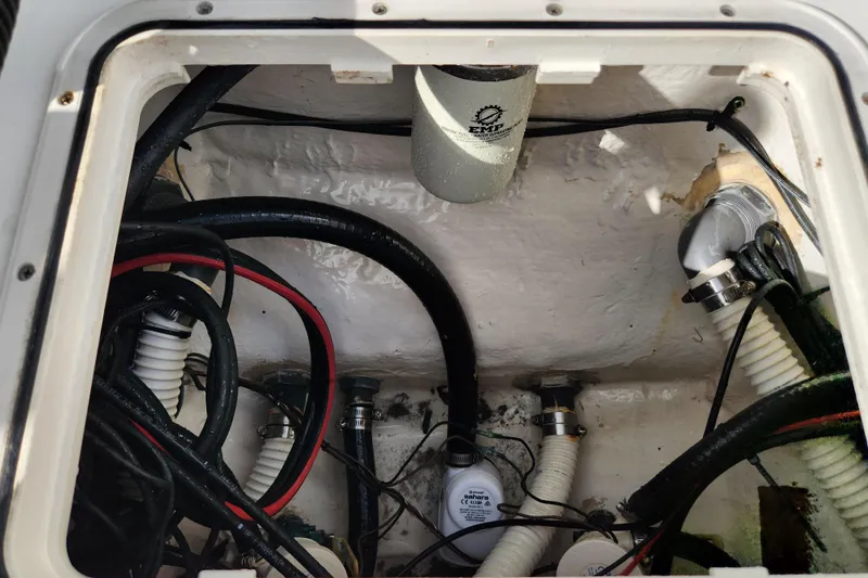 Slide: The Image of 2019 Key West 230 Bay Reef boat compartment with wiring and components. - 20