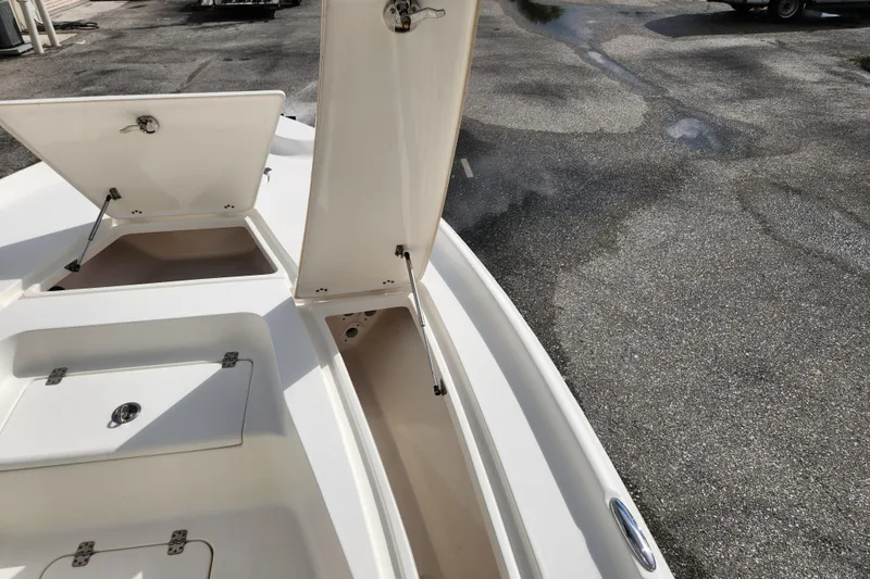 Slide: The Image of 2019 Key West 230 Bay Reef boat with open storage compartments on deck. - 27
