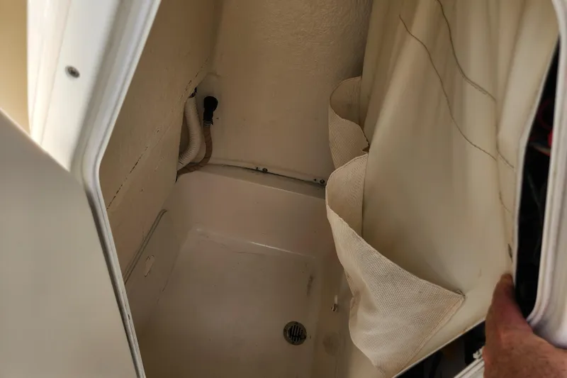Slide: The Image of Interior view of a 2019 Key West 230 Bay Reef boat compartment with storage space. - 30