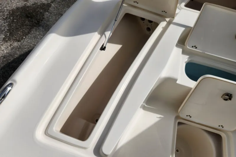 Slide: The Image of 2019 Key West 230 Bay Reef boat storage compartments and hatches, open and empty. - 22