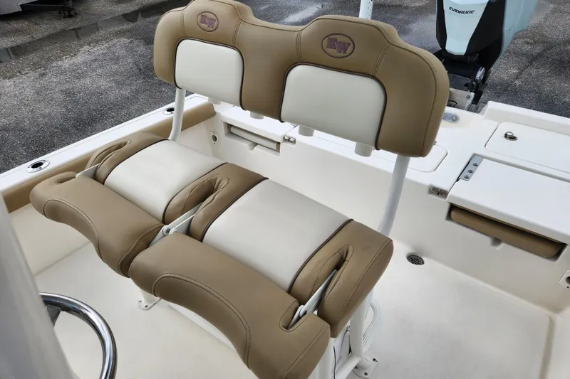 Slide: The Image of 2019 Key West 230 Bay Reef boat seating with tan and white upholstery. - 12