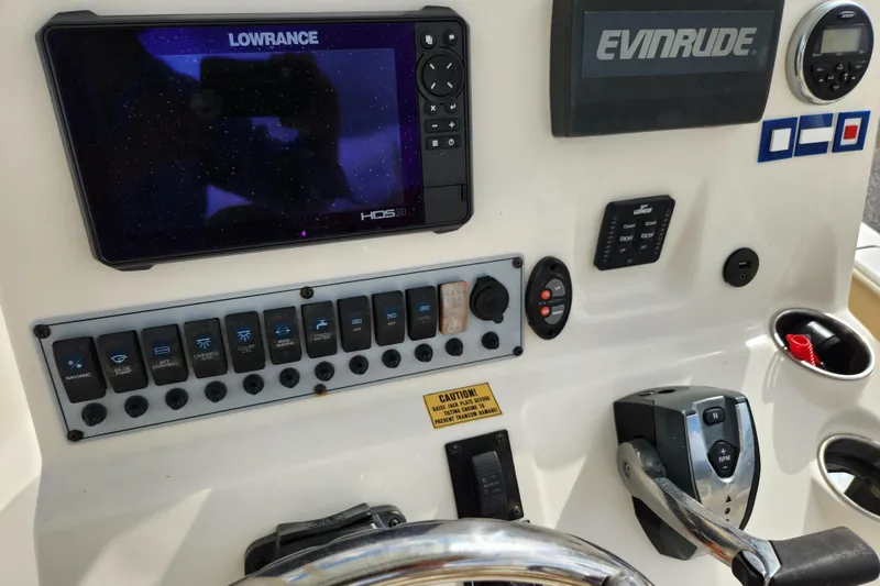 Slide: The Image of Control panel of a 2019 Key West 230 Bay Reef boat with Lowrance and Evinrude equipment. - 14