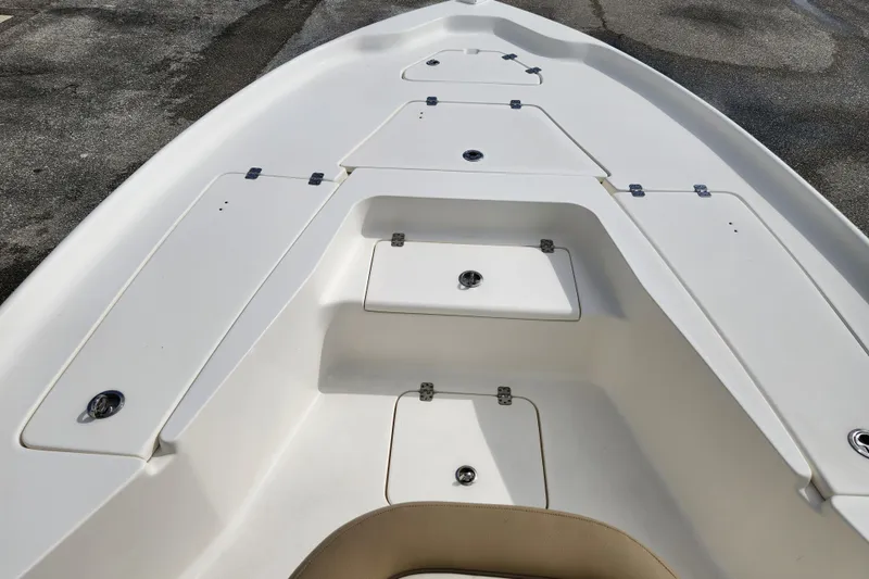 Slide: The Image of 2019 Key West 230 Bay Reef boat deck with storage compartments. - 7