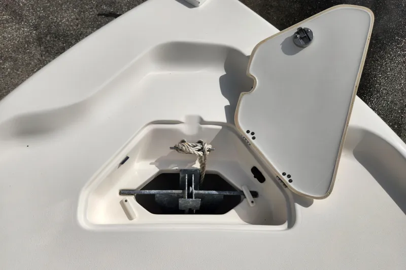 Slide: The Image of Open anchor compartment on 2019 Key West 230 Bay Reef boat. - 29