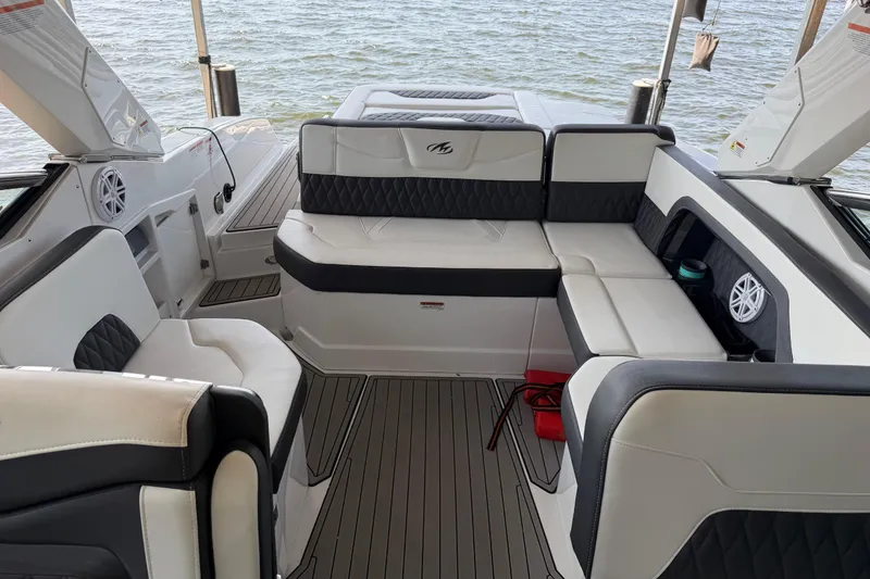 Slide: The Image of Luxurious interior of 2020 Monterey 298SS Super Sport boat with stylish seating and speakers. - 11