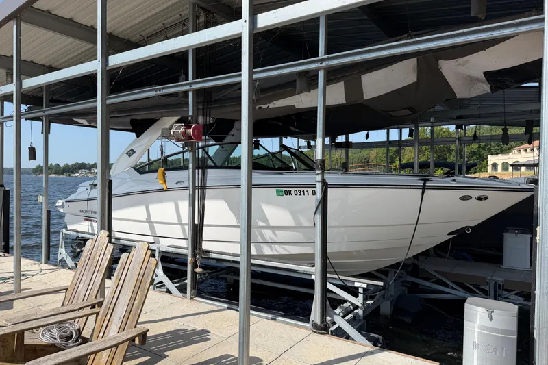 Slide: The Image of 2020 Monterey 298SS Super Sport boat docked in a covered marina. - 4