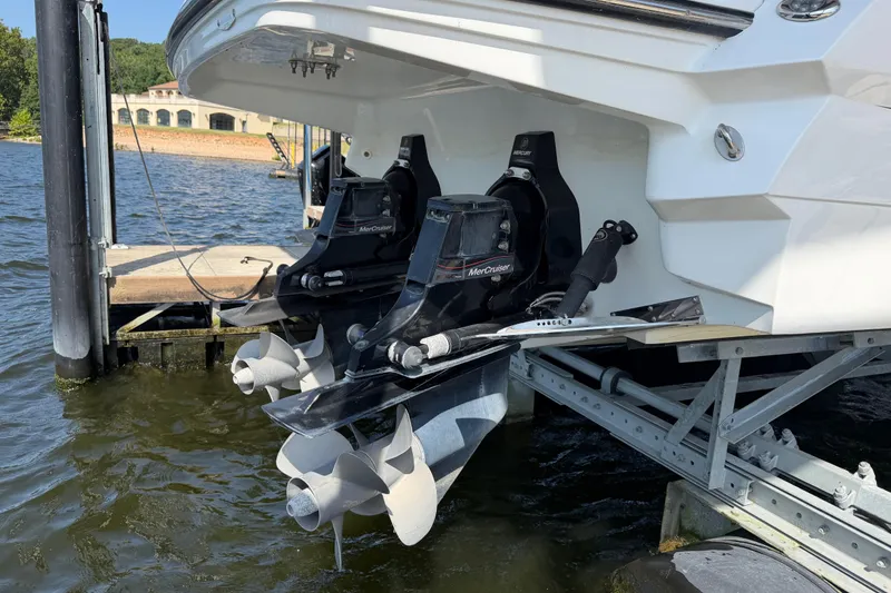 Slide: The Image of 2020 Monterey 298SS Super Sport boat with dual MerCruiser engines on a dock. - 3
