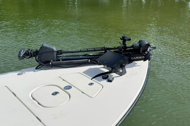 Slide: The Image of 2007 Hewes Redfisher 21 boat with Garmin equipment on calm water. - 21