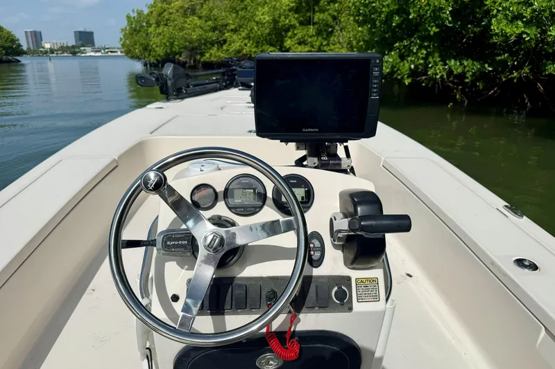 Slide: The Image of 2007 Hewes Redfisher 21 boat console with steering wheel and Garmin display. - 10