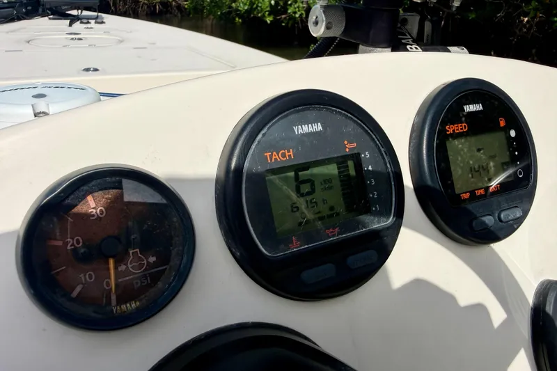 Slide: The Image of Dashboard of a 2007 Hewes Redfisher 21 boat with Yamaha gauges. - 13