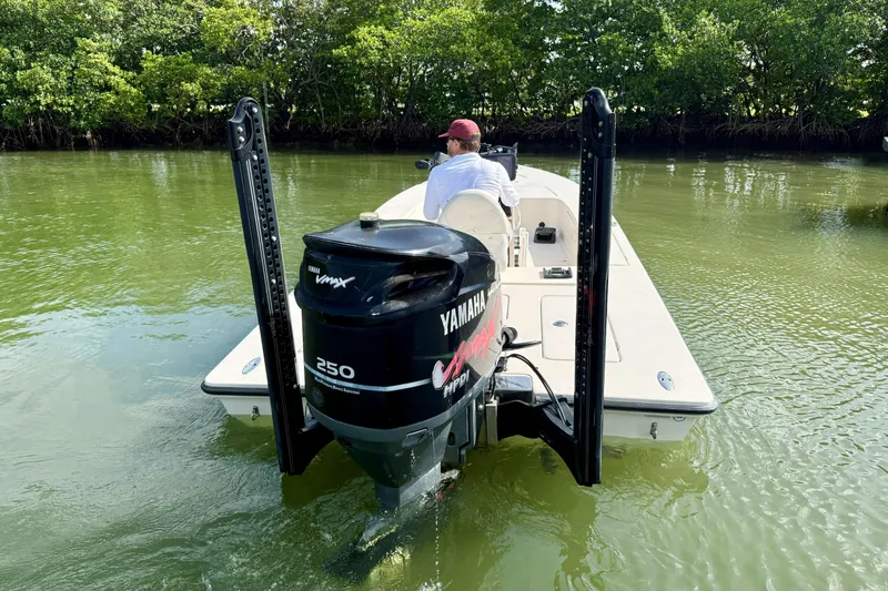 Slide: The Image of 2007 Hewes Redfisher 21 boat with Yamaha VMAX 250 engine on calm water. - 9