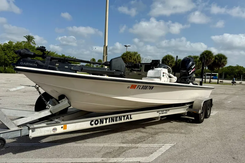 Slide: The Image of 2007 Hewes Redfisher 21 boat on trailer, equipped with Garmin technology, parked outdoors. - 27