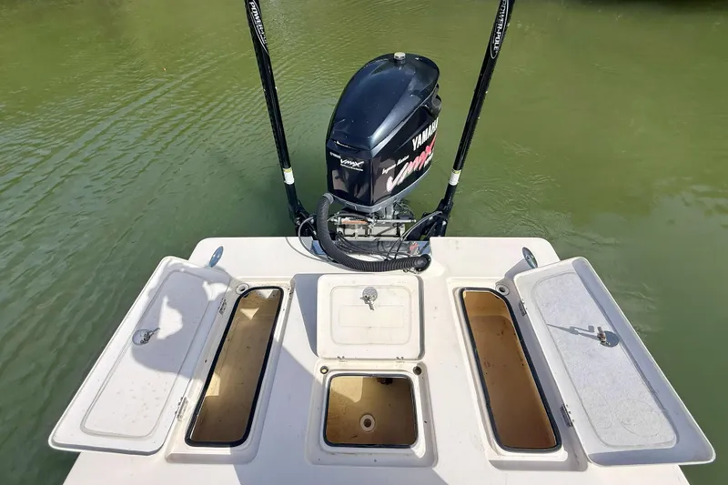 Slide: The Image of 2007 Hewes Redfisher 21 boat with Yamaha VMAX engine on calm water. - 16