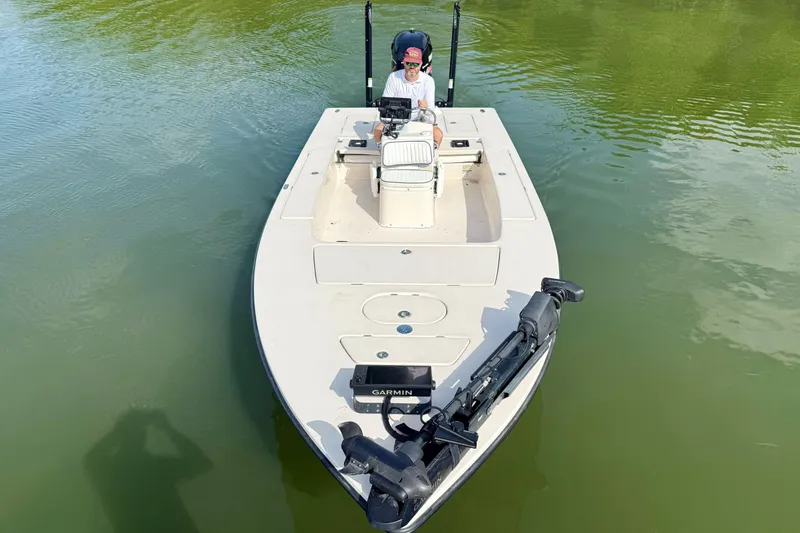 Slide: The Image of 2007 Hewes Redfisher 21 boat on calm water, featuring Garmin equipment. - 6