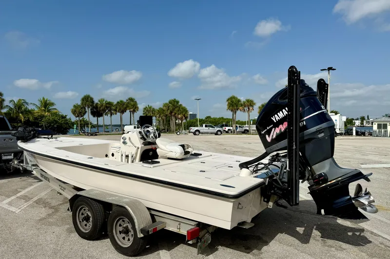 Slide: The Image of 2007 Hewes Redfisher 21 boat on trailer with Yamaha outboard motor in sunny parking lot. - 23