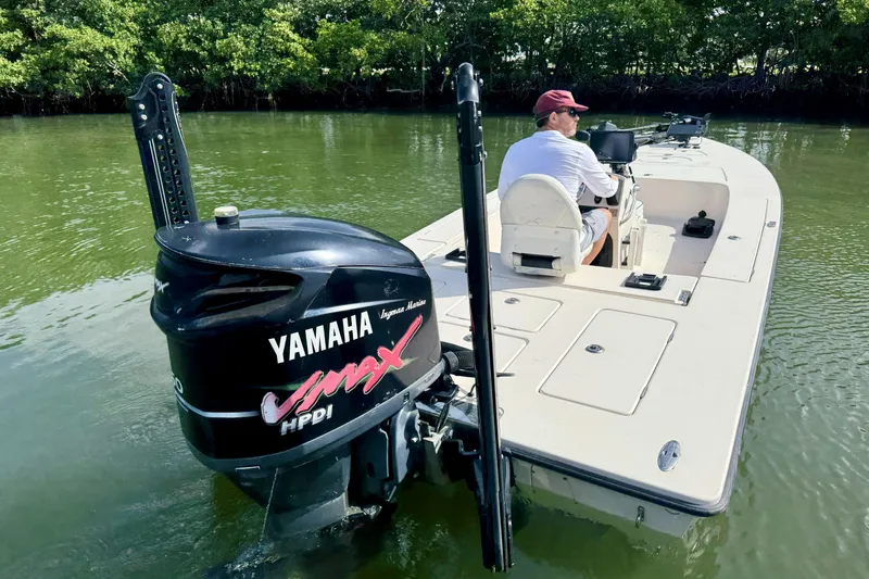Slide: The Image of 2007 Hewes Redfisher 21 boat with Yamaha VMAX engine on calm water. - 8