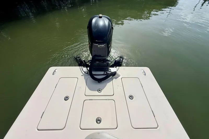 Slide: The Image of 2007 Hewes Redfisher 21 boat with Yamaha outboard motor on calm water. - 15