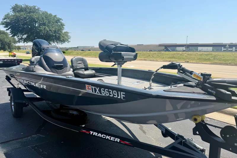 The Image of 2021 Tracker Pro Team 175 TF boat on trailer, parked outdoors, sunny day. - 0
