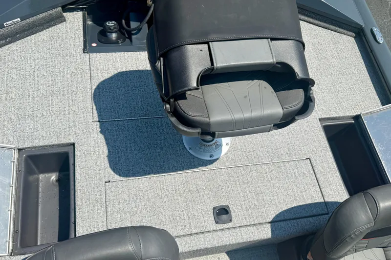 Slide: The Image of 2021 Tracker Pro Team 175 TF boat interior with seating and storage compartments. - 7