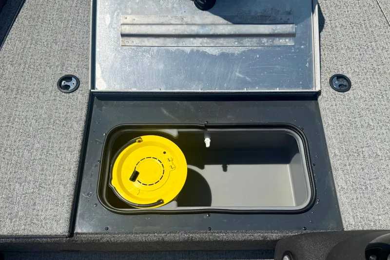 Slide: The Image of 2021 Tracker Pro Team 175 TF boat livewell with yellow lid, open compartment view. - 11