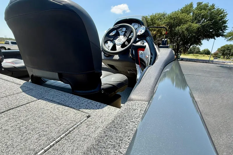 Slide: The Image of 2021 Tracker Pro Team 175 TF boat interior with steering wheel and seating. - 3