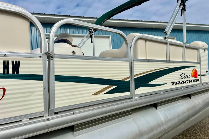 Slide: The Image of 2010 Sun Tracker Party Barge 20 Classic Series pontoon boat, side view with logo. - 9