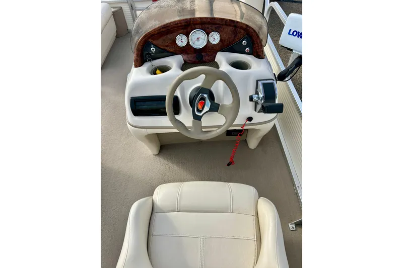 Slide: The Image of Steering console of a 2010 Sun Tracker Party Barge 20 Classic Series pontoon boat. - 17