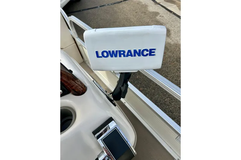 Slide: The Image of Lowrance device on 2010 Sun Tracker Party Barge 20 Classic Series boat dashboard. - 30