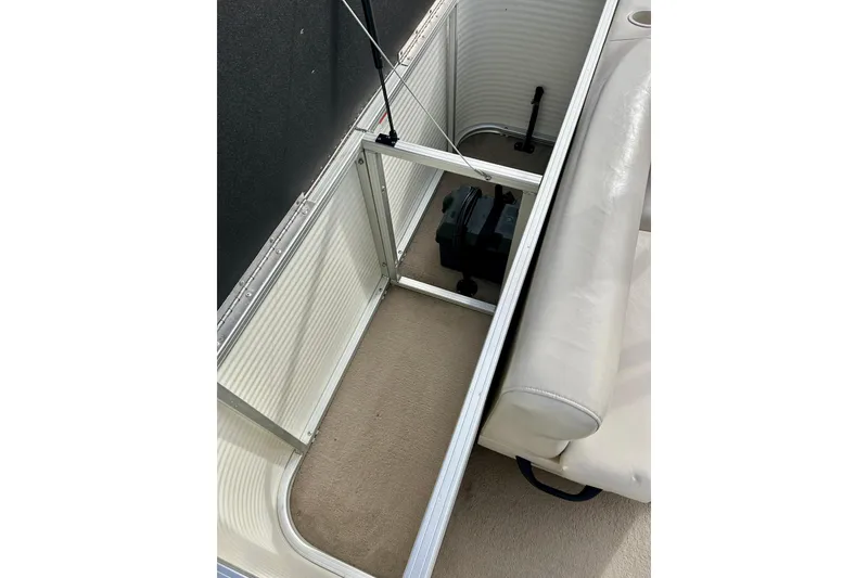 Slide: The Image of 2010 Sun Tracker Party Barge 20 Classic Series interior seating and storage area. - 28