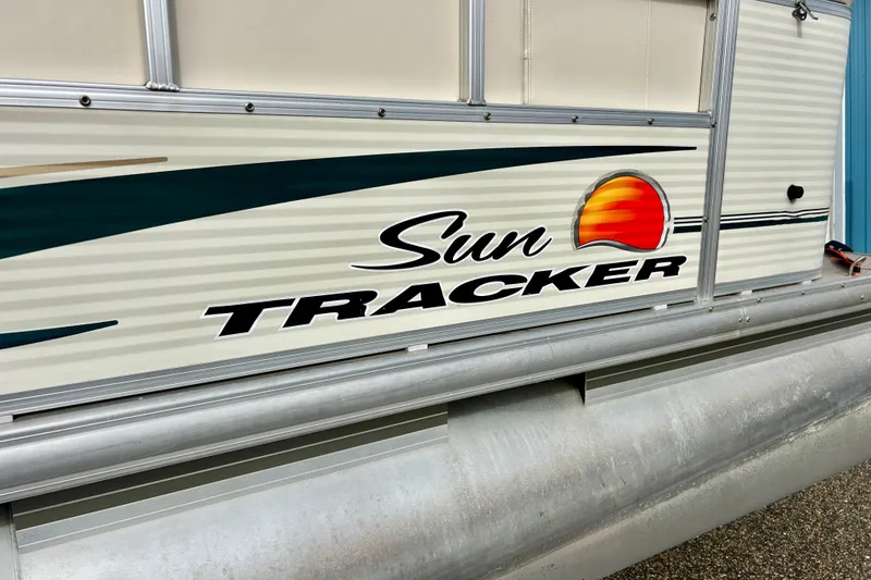 Slide: The Image of 2010 Sun Tracker Party Barge 20 Classic Series pontoon boat side view with logo. - 5