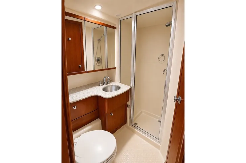 Slide: The Image of Luxurious bathroom in 2007 Meridian 341 Sedan yacht with shower and wooden cabinetry. - 10