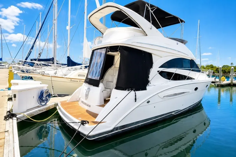 Slide: The Image of 2007 Meridian 341 Sedan yacht docked at marina under clear blue sky. - 18