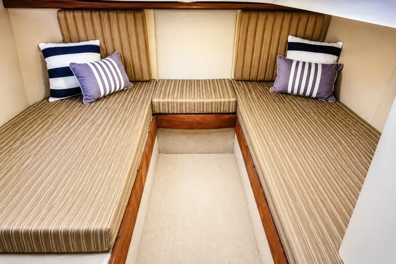 Slide: The Image of Interior cabin of 2007 Meridian 341 Sedan with striped cushions and decorative pillows. - 11