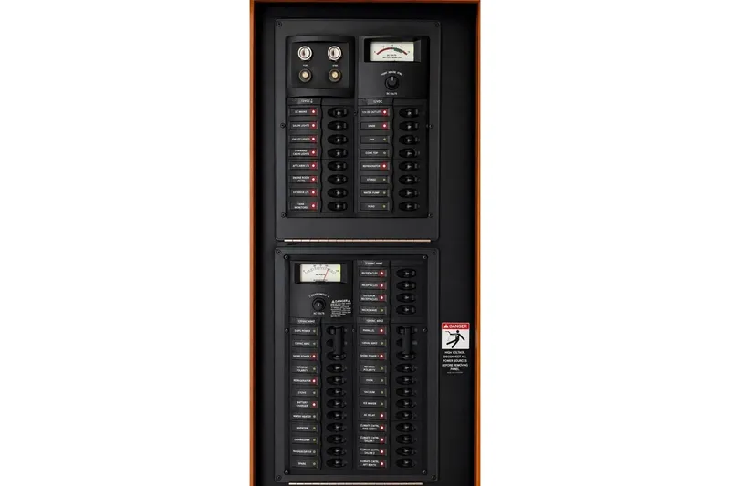 Slide: The Image of Electrical panel of a 2007 Meridian 341 Sedan boat, featuring circuit breakers and gauges. - 21