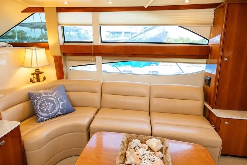 Slide: The Image of Luxurious interior of 2007 Meridian 341 Sedan yacht with beige leather seating and nautical decor. - 7