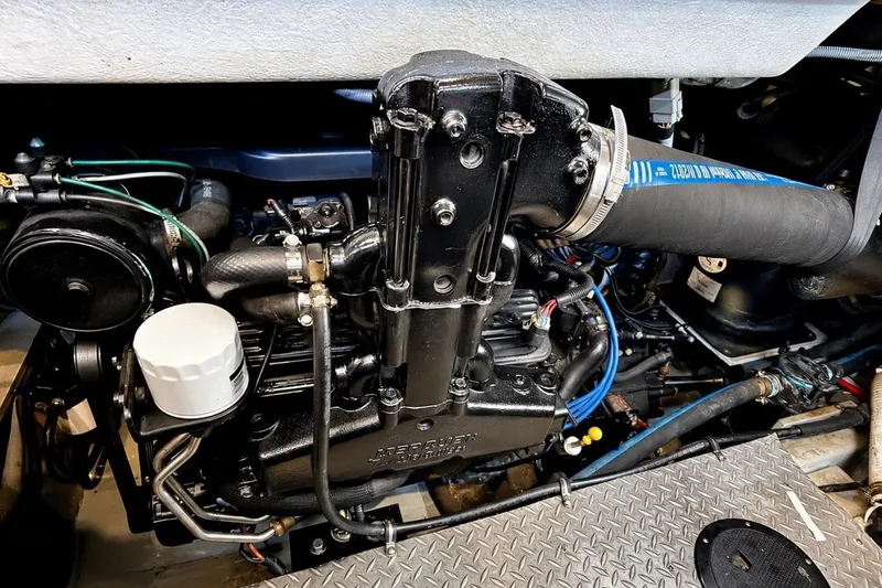 Slide: The Image of Engine compartment of a 2007 Meridian 341 Sedan, showcasing detailed mechanical components. - 23