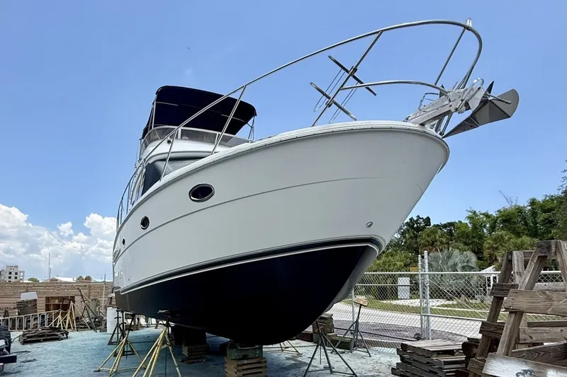 Slide: The Image of 2007 Meridian 341 Sedan yacht on dry dock, clear sky background. - 20