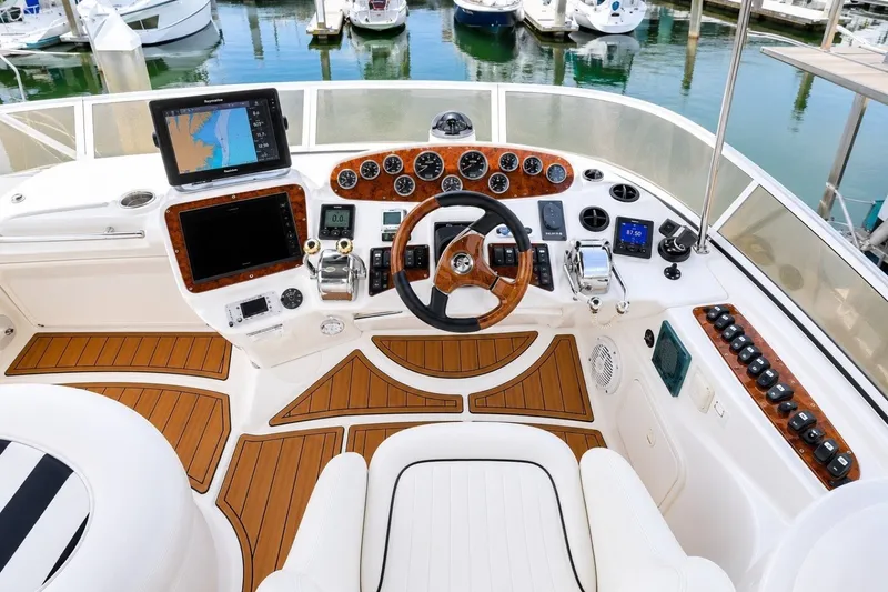 Slide: The Image of Cockpit of 2007 Meridian 341 Sedan yacht with modern navigation equipment and wooden accents. - 15