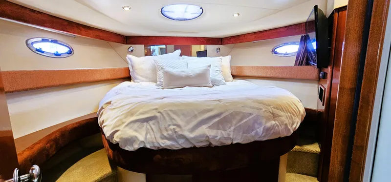 Slide: The Image of Luxurious bedroom interior of 2007 Meridian 341 Sedan yacht with cozy bedding. - 7