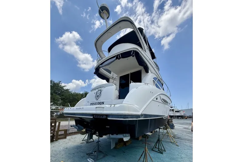 Slide: The Image of 2007 Meridian 341 Sedan yacht on dry dock under a clear blue sky. - 19