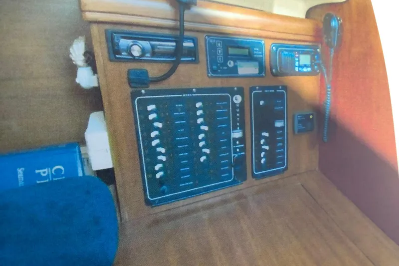 Slide: The Image of Control panel of a 2003 Hunter 306 sailboat with navigation and communication equipment. - 16
