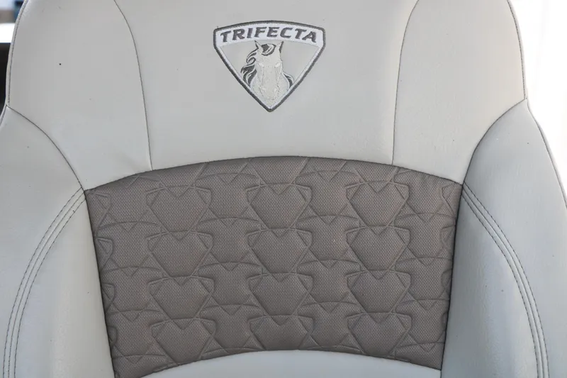 Slide: The Image of Close-up of 2019 Trifecta 23RF SS Arch boat seat with logo and textured upholstery. - 39