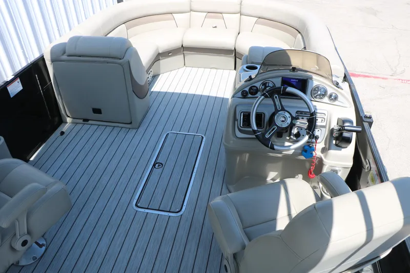 Slide: The Image of 2019 Trifecta 23RF SS Arch boat interior with helm, seating, and modern dashboard. - 30